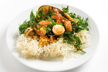 stir fired seafood serve on crispy noodles