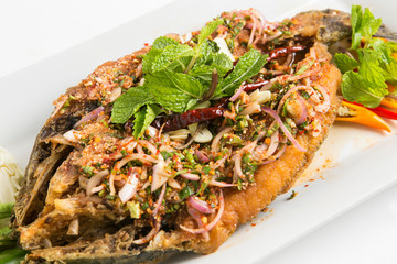 spicy larb salad sauce put on fired sea bass fish