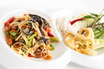 spicy papaya salad with small crabs eat with thai noodle and fired skin pork