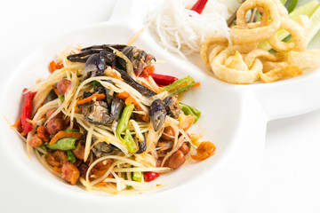 spicy papaya salad with small crabs eat with thai noodle  fired skin pork  and cabbage