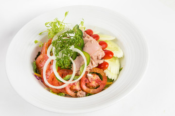 tuna salad in a white plate lots of vegetable and healthy food
