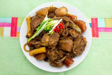 Korean chicken stew with soy sauce, glass noodle, rice cake and vegetables