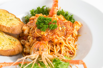 spaghetti tomato sauce with big freshwater prawn serve with garlic bread