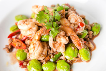 stir fried bitter beans or stink beans or twisted cluster bean thai called sato with shrimps and minced pork