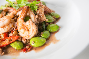 stir fried bitter beans or stink beans or twisted cluster bean thai called sato with shrimps and minced pork