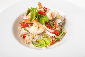 delicious spicy mixed seafood thai food made from shrimps squids minced pork kale chili and vegetable serve in white dish close up