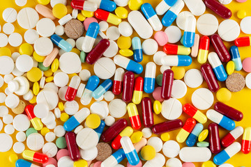 A lot of colorful medication and pills from above. Pharmaceutical industry concept.
