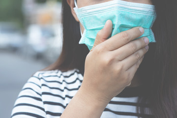 Sick infectious woman asian with wearing protection medical face mask against coronavirus portrait. close up pandemic virus disease. Health care Covid 19 outbreak contamination concept.