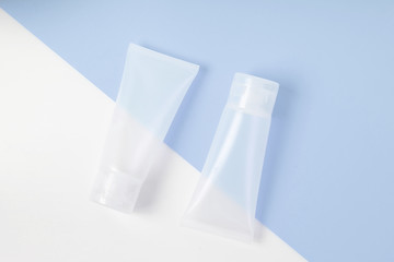 cosmetic tube pack on white and blue