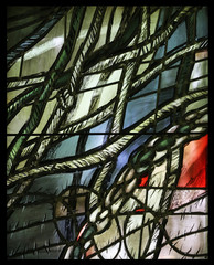 Simon of Cyrene carries the cross,  detail of stained glass window by Sieger Koder in Chapel in the Jesuit cemetery in Pullach, Germany