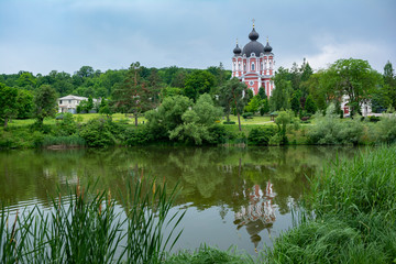 Fototapeta na wymiar Beautiful view of Curchi Monastery and lake with reflections, Moldova