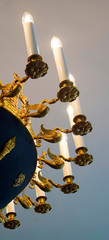 gold chandelier with lamps in the form of candles