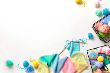 Women crochet and knitting from colored yarn. Top view.