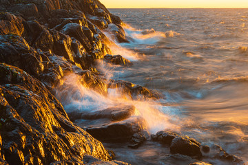 Waves crashing against shoreline at Lake Vättern, Sweden.