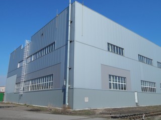 Fototapeta na wymiar The building of an industrial enterprise. Modern factory. The industrial landscape.