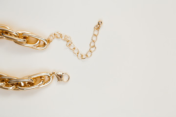 massive golden braided chain bracelet on a white background in isolation copy space place text