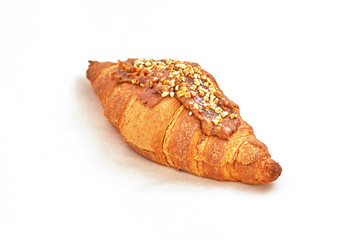 Croissant Fresh baked puff pastry. Closeup on a light background
