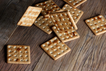 texture cookies on a blurry background falling on a wooden table