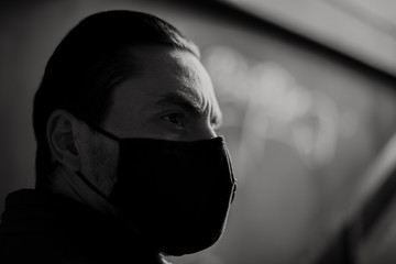 Caucasian man wearing breathing protective face mask outdoor