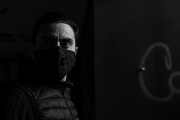 Caucasian man wearing breathing protective face mask outdoor