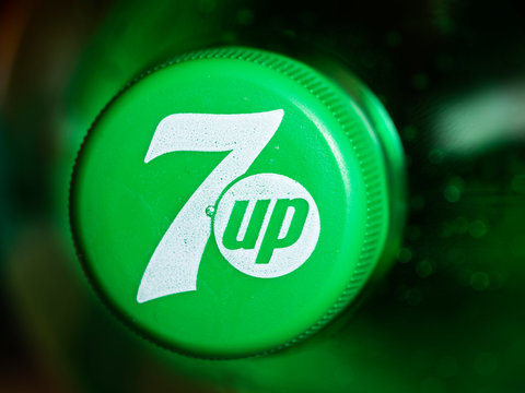 In this photoillustration Logo of 7up is seen on a bottle cap
