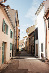 Travel summer concept. Old city view of Europe, Croatia, Istria region, Rovinj. Empty street with old buildings with shutters.