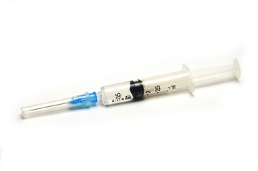 Fototapeta premium medical syringe with medicine on a white