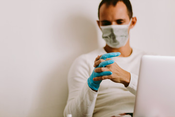 Man Wearing Latex Gloves and face mask