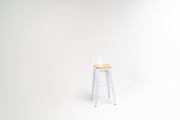High chair on a white background. Minimalism. Isolated. Horizontal photo