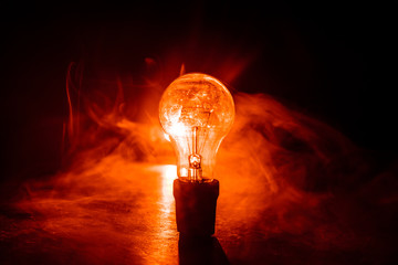 Abstract dark background with creative artwork decoration of glowing bulbs.