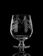 a glass for cognac on a black background