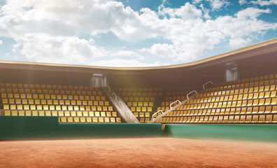 Tennis court with bleachers. Cloudy blue sky