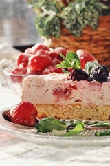 Fresh delicious dessert with berries and green decoration, sweet food, tea time, close up