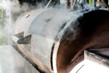 Large barbecue smoker grill at the park. Meat prepared in barbecue smoker.