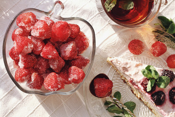 Fresh delicious dessert with berries and green decoration, sweet food, tea time, top view