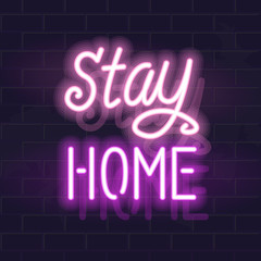 Neon stay home handwritten lettering. Glowing vector motivation typography. Fluorescent letters on dark brick wall background.
