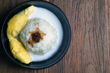 'Pulut Durian' is a glutinous or sticky rice with durian, coconut milk and sprinkle of grated palm sugar-selective focus
