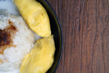 'Pulut Durian' is a glutinous or sticky rice with durian, coconut milk and sprinkle of grated palm sugar-selective focus