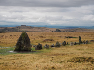 Bronze Age standing Stone Rows at Merrivale Prehistoric site with Vixen Tor in the background and...