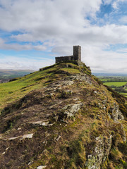 The isolated 13th century church of St Michael de Rupe which sits on top of Brent Tor, an old weathered volcano, Dartmoor National Park, Devon, UK