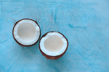 top view coconut halves  on a blue background