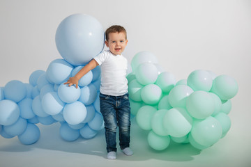 Fototapeta premium little boy with colored balloons
