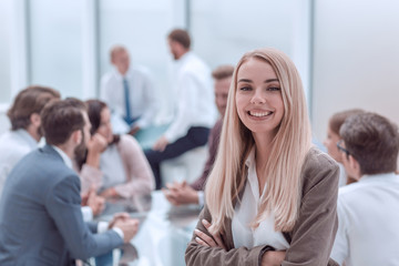 close up. smiling young employee standing in the office