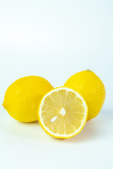 Fototapeta na wymiar Sliced fresh lemon for summer drink on white background.