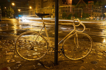 Naklejka na ściany i meble Spirit of the cyclist on the street at night in Poznan..