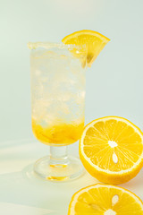 Fresh lemon soda drink iced with lemon sliced on white background.