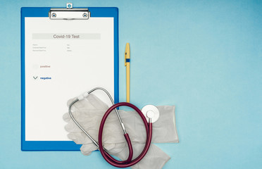 Coronavirus, covid-19. Coronavirus test results on a blank, blue background. Protective mask and...