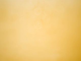 Golden and pink background with soft bokeh lights.