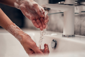 Fototapeta premium Coronavirus. Proper washing and handling of hands. Liquid antibacterial soap. Self-isolation and hygiene.
