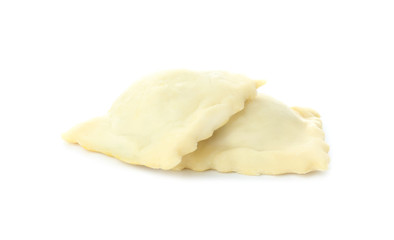 Raw ravioli on white background